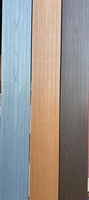 Light gray co-extruded composite decking with wood grain texture