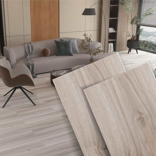 Light brown wood-look SPC flooring in a modern Florida living room with gray couch