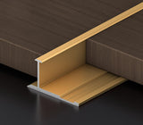 Gold 3mm aluminum H-joint connection trim positioned between dark wood-look PVC wall panels
