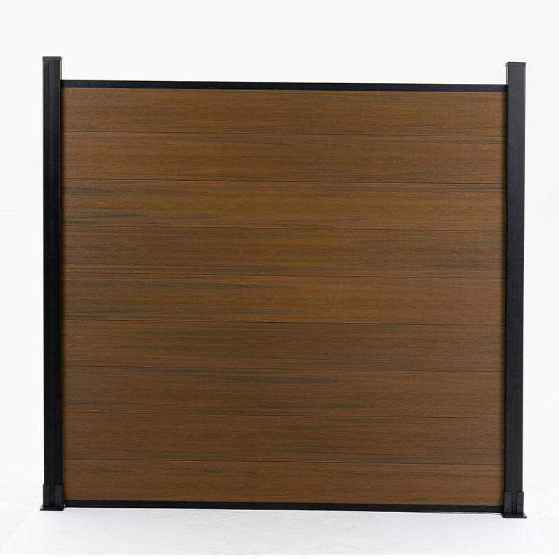 Straight-on view of walnut composite privacy fence panel with black frame