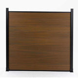 Straight-on view of walnut composite privacy fence panel with black frame