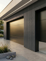 Gray composite wide exterior cladding installed vertically around a modern garage and entryway