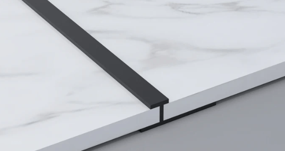 Black 3mm aluminum H-joint connection trim joining white marble-look PVC wall panels