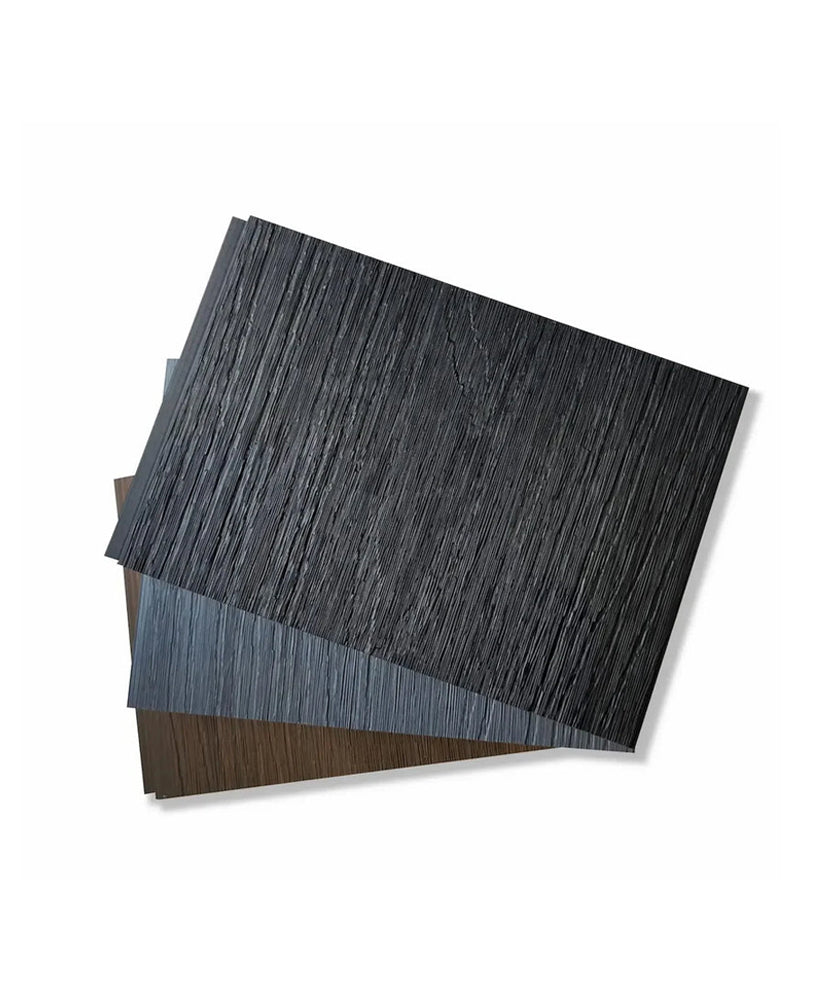 Three overlapping composite fence samples in black, gray, and brown with wood-grain texture