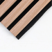 Close-up of unfinished oak wood slatted panel with black background