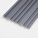 Gray ribbed WPC wall panel with reflective finish and rectangular cutouts