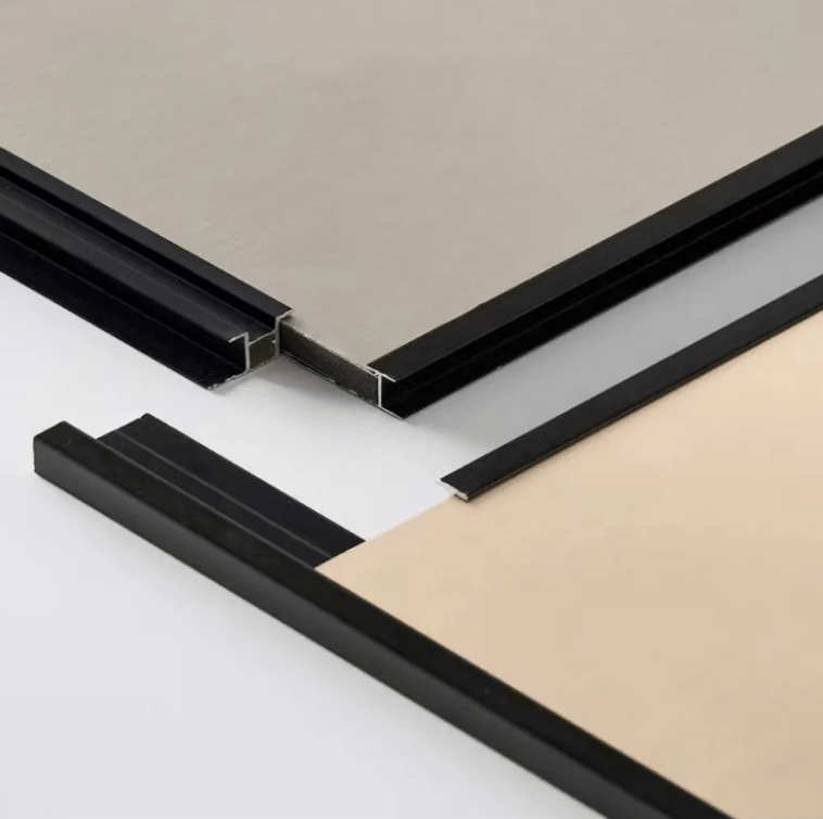 Black aluminum channel trims fitted along the edges of beige wall panels