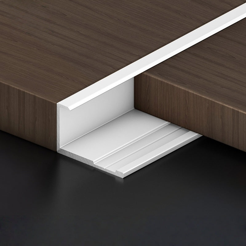 White 3mm aluminum end cap trim finishing the edge of a dark wood-look PVC wall panel