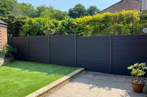 Dark gray composite wood fence with horizontal planks