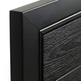 Close-up of black frame corner and textured wood-grain panel on WPC fence gate
