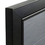 Close-up of black frame corner and textured light gray panel on WPC fence gate