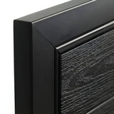 Close-up of the black frame corner and textured black wood-grain WPC gate panel