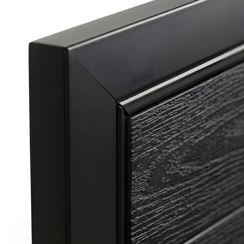 Close-up of the black frame corner and textured black wood-grain WPC gate panel