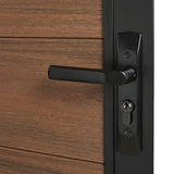 Close-up of black lever handle and keyed lock on brown WPC fence gate