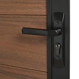 Close-up of the black lever handle and keyed lock on the brown WPC fence gate