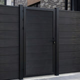 Black WPC fence gate installed within matching horizontal privacy fence panels