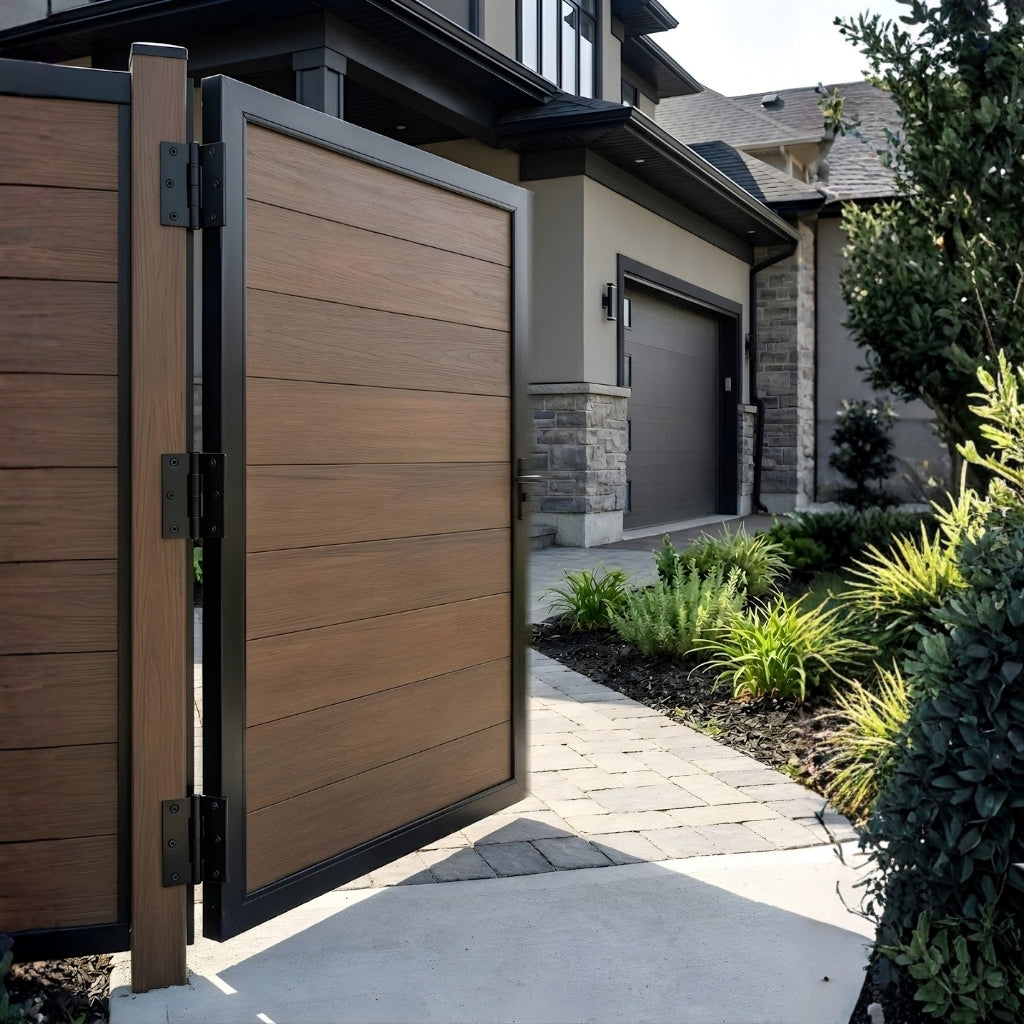 Open brown WPC fence single gate beside a landscaped residential walkway